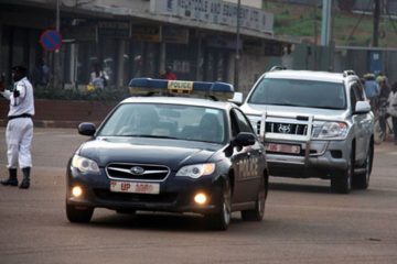 A Police lead car escorting a Ugandan Government Official's motorcade/convoy